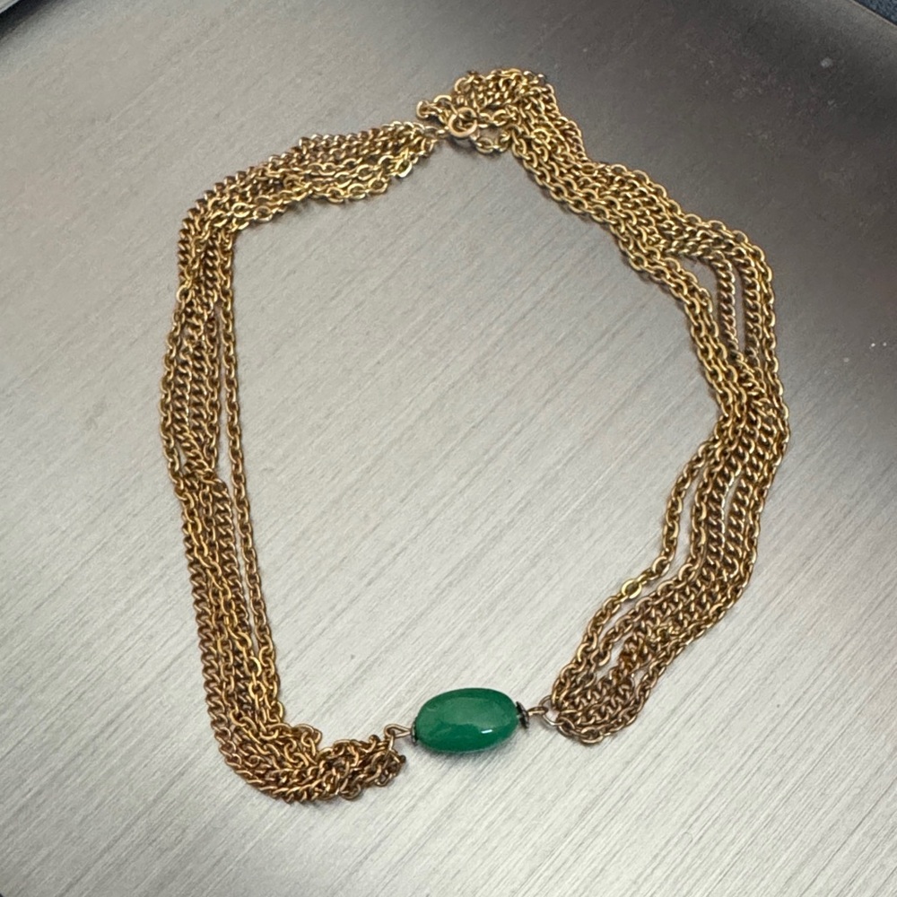Elegant Gold Necklace with Green Stone